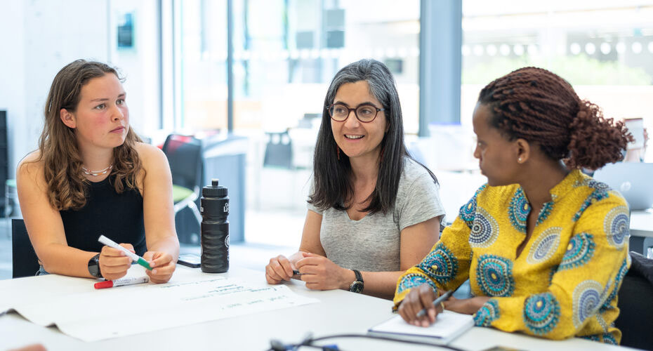 A group of staff discussing a topic on a People Development course