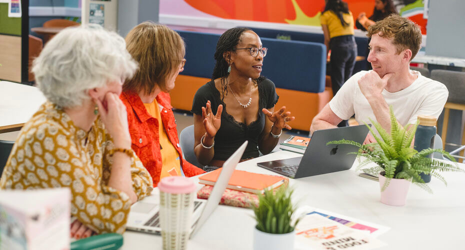 A group of PhD students socialising on campus